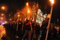 Members of the nationalist organizations hold torches as they take part in a rally marking the 70th death anniversary of Roman Shu