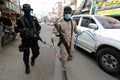 Members of the Palestinian Islamic Jihad`s armed wing, the Al-Quds Brigades, spray disinfectant in the streets of Rafah in the sou