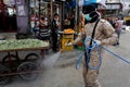 Members of the Palestinian Islamic Jihad`s armed wing, the Al-Quds Brigades, spray disinfectant in the streets of Rafah in the sou