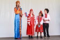 A Russian family on stage in traditional dress