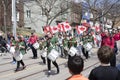 Members of Scouts Canada play drums as they march along Queen St