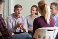 Members Of Support Group Sitting In Chairs Having Meeting Royalty Free Stock Photo