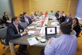 Members at the table debating on Business Breakfast