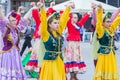 Members of theater groups in national costumes at the festive procession of graduates of schools