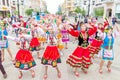 Members of theater groups in national costumes at the festive procession of graduates of schools