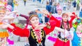 Members of theater groups in national costumes at the festive procession of graduates of schools