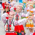 Members of theater groups in national costumes at the festive procession of graduates of schools