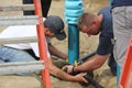 Rotary members from the community helping to build a playground for children.