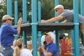 Rotary members from the community helping to build a playground for children.