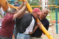 Rotary members from the community helping to build a playground for children.