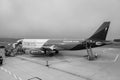 Plane Wizz Air company on airfield, black and white. Low cost aviation company. International travel concept. Wizzair company jet.