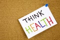 Memo note pinned to a cork notice board as reminder Think Health Royalty Free Stock Photo