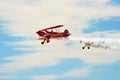 Memorial Airshow, Bucker Jungmeister in flight, smoke effect