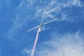 Memorial Airshow. Flying Glider aerobatic team withlight sailplane showing his performance, smoke effect