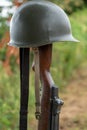 Memorial battlefield cross. Symbol of a fallen US soldier. M1 rifle with helmet Royalty Free Stock Photo