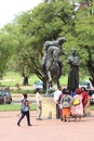 People at one of the statues at the Women`s Monument or Vrouemonument