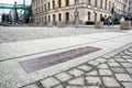 Memorial board of Berlin wall on pavement, Germany