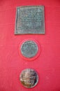 Memorial brass plaques on side of Smeaton`s Tower, Plymouth, UK