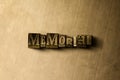 MEMORIAL - close-up of grungy vintage typeset word on metal backdrop