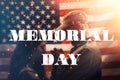 Memorial day. A soldier holds the hands of his beloved woman. Couple on the background of the American flag with sparks in the