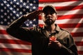 Memorial day. A soldier in uniform salutes against the background of the American flag with a candle in his hands. The concept of Royalty Free Stock Photo