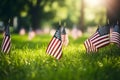 Memorial Day tribute. Many small American flags on a green lawn, neural network generated photorealistic image Royalty Free Stock Photo