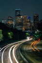 Memorial Drive and the Houston skyline at night, in Houston, Texas