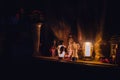 Memorial light lamps near tombstone statue at night cemetery soft focus on lamp concept of faith