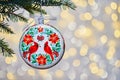 Memorial ornament red cardinal. Golden Christmas Tree Scene Lights Background Royalty Free Stock Photo