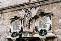 Memorial panel with a sculpture of an angel in the Varenna cemetery, Italy