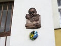 Memorial plaque with bas-relief Mykhailo Hrushevsky on the wall in Uzhgorod