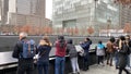 911 Memorial Pool with visitors and their cameras.