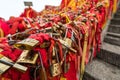 Red ribbons and padlocks along trail on Huashan Mountain