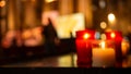 Memorial wax candles in red and white glass in church. Royalty Free Stock Photo