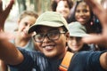 Memories made at summer camp last forever. a group of teenagers taking a selfie at summer camp.