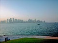 View of west bay skyscrapers skyline from the beach at sunset Royalty Free Stock Photo