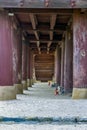 Historical Korean Buddhism temple corridor between the pillars.