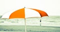 An old beach umbrella on the beach Royalty Free Stock Photo