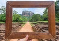 Memories in photoframe with landcape of Sigiriya mountain and famous historical and archaeological site.