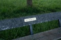 `Memories`, a sign on a park bench