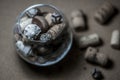 Memories about vacation. Seashell, Wine cork, Chestnuts and Cones in Glass Royalty Free Stock Photo