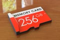 Memory card 256 GB on the wooden table. 3D rendering