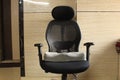 Memory foam sciatica cushion in black office chair at home