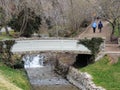 Memory Grove Park views of Waterfalls and streams leading into a small pond or lake surrounded by walking paths and trees in Salt Royalty Free Stock Photo