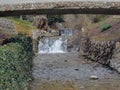 Memory Grove Park views of Waterfalls and streams leading into a small pond or lake surrounded by walking paths and trees in Salt Royalty Free Stock Photo