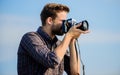 A memory like. travel with camera. male fashion style. looking trendy. photographer in glasses. capture adventure Royalty Free Stock Photo