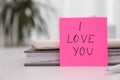 Memory sticker with phrase I Love You at table, space for text. Valentine`s Day celebration Royalty Free Stock Photo