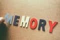 MEMORY, word with wooden letters on background with colored cloth