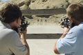 Men Aiming Rifles At Firing Range Royalty Free Stock Photo