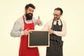 Men bearded bartender or cook in apron hold blank chalkboard. Workers wanted. Bartender with blackboard. Hipster Royalty Free Stock Photo